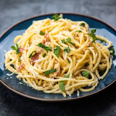 Spaghetti Carbonara with Cream Sauce Focused on White Plate, Delicious Italian Dish