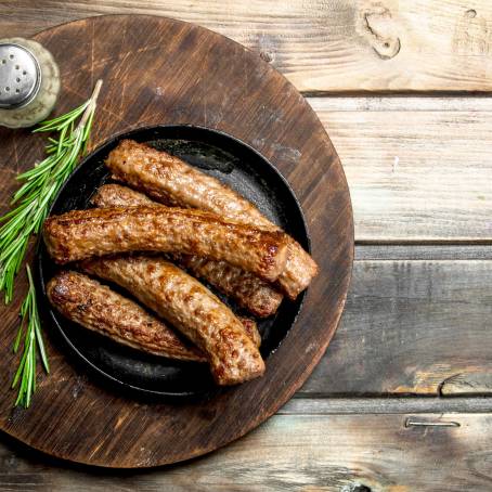 Spicy Grilled Sausages, Whole Hot Dogs, Isolated on White, Savory Meat Dish, Flavorful Feast