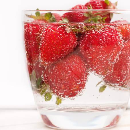 Strawberry Close Up in Sparkling Water with Tiny Bubbles