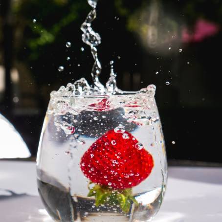 Strawberry with Bubbles in Sparkling Water Close Up Shot