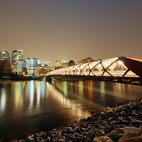 Stunning Night Reflection of Calgarys Peace Bridge and Downtown in Bow River