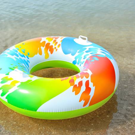 Summer Bliss Inflatable Ring Floating Amidst Vibrant Sea Waves