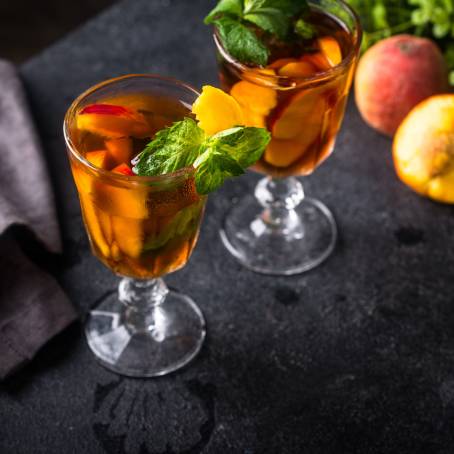 Summer Cold Peach Fizz Cocktail or Iced Tea with Mint