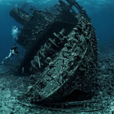 Sunken Shipwreck in Mediterranean Sea with Scuba Diver