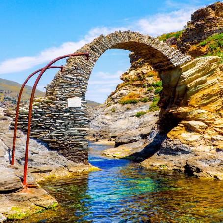 Sunrise Glow on Ancient Stone Bridge to Andros Castle, Greece