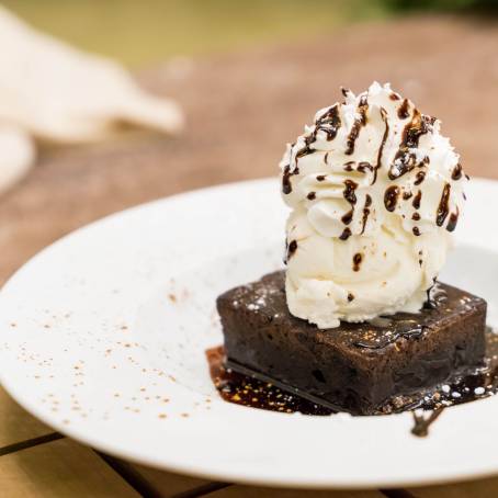 Sweet Apple Pie Slice with Vanilla Ice Cream Scoop