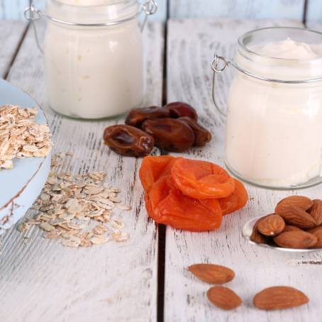 Tasty Healthy Cookies with Nuts and Fruits in Glass Container