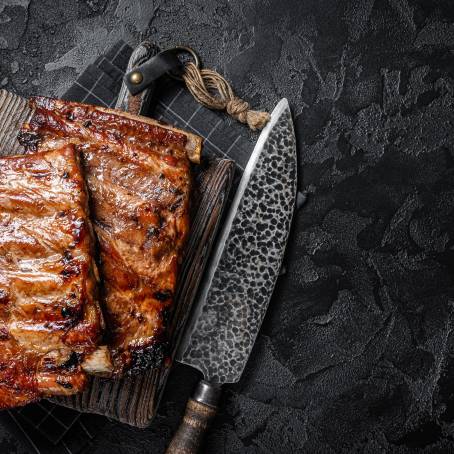 Tender Smoked Ribs with Rich Barbecue Sauce on a Carving Board