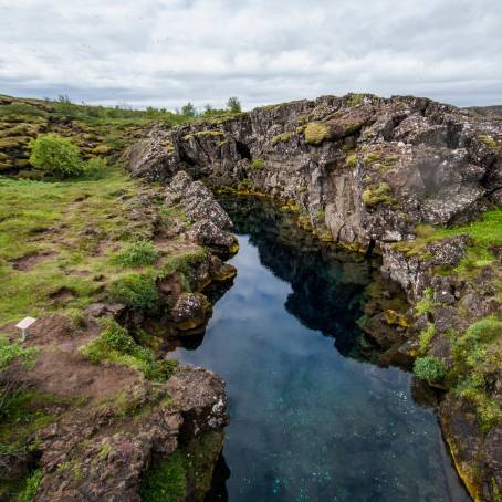 The Serene River Winding Through Thingvellir Canyon