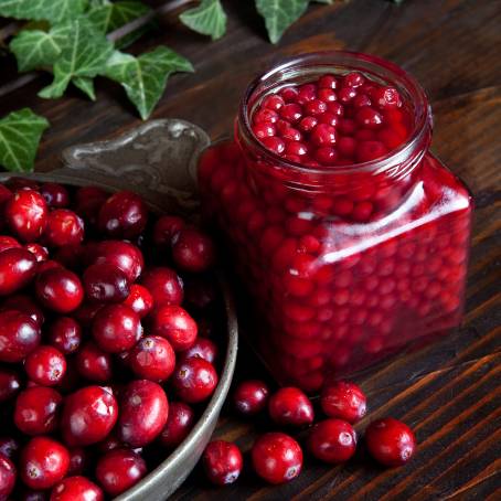 Top View of Cranberries with Leaves on White Isolated Berries with Full Depth of Field