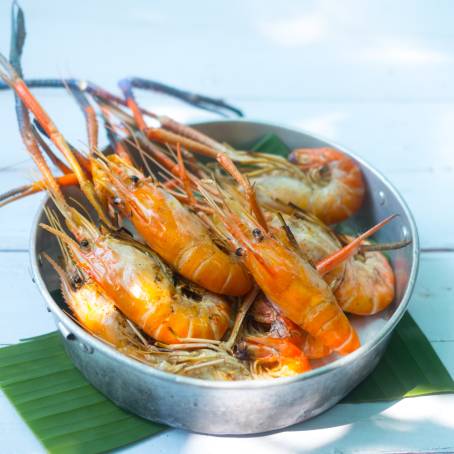 Top View of Delicious Grilled Prawns on Black Plate Ready for Serving and Food Photography