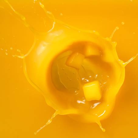 Top View of Fresh Yellow Mango Isolated on Plain White Background, Perfect for Food Photography