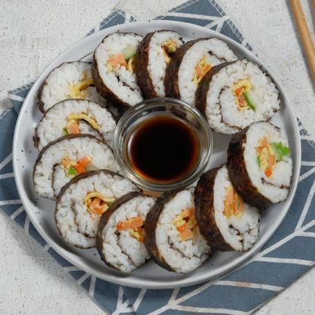 Top View of Gimbap Traditional Korean Sushi Rolls on White Background, Fresh and Ready