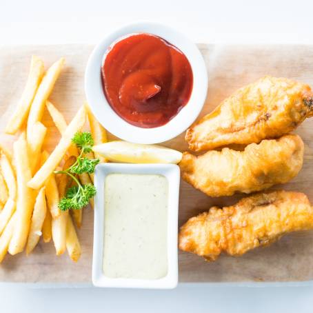 Top View of Golden Fish and Chips on a White Plate