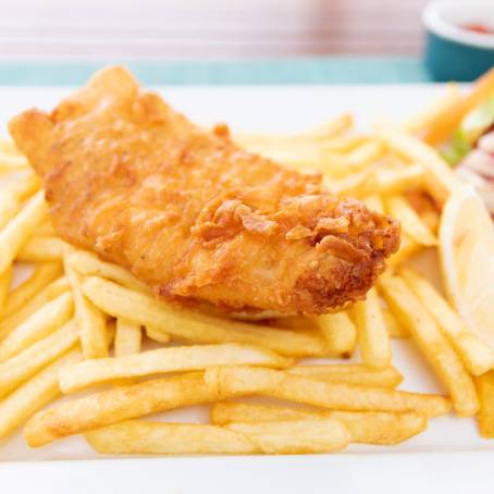 Top View of Hot Fish and Chips on a White Plate