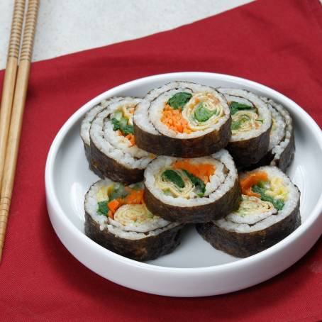 Top View of Korean Gimbap Fresh and Flavorful Rolls on White Background