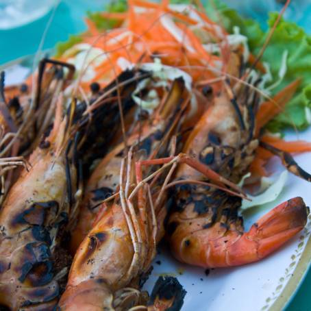 TopDown Image of Grilled Prawns on Black Plate Ready to Serve for Gourmet Dining