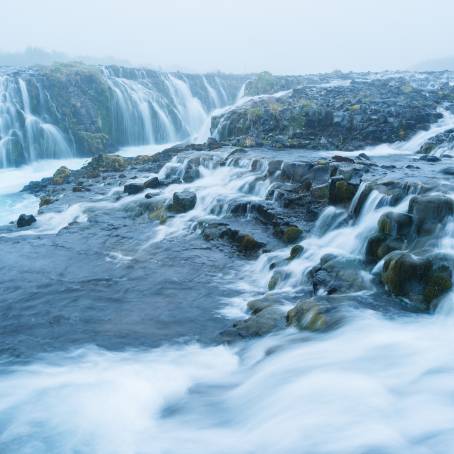 Turquoise Waterfalls Flowing Through Sigoeldugljufur Canyon