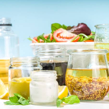 Variety of Homemade Salad Dressings in Mason Jars Vinaigrette, Ranch, and Honey Mustard