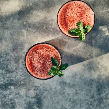 Vibrant Close Up of Watermelon Smoothie and Juice for a Summer Refreshment