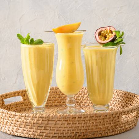 Vibrant Mango Smoothie in Tall Glasses for a Healthy Boost