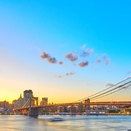 Vintage Brooklyn Bridge with Glowing Sunrise in NYC