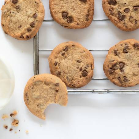 Warm Cookies on a Rack Paired with Cold Milk and Salt