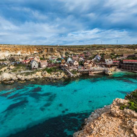 Whimsical Popeye Village, Malta Coastal Colors  Cinematic Charm