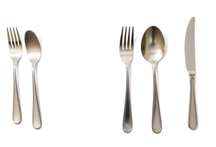 White Background with Plastic Cutlery Forks, Knives, Spoons for Dining