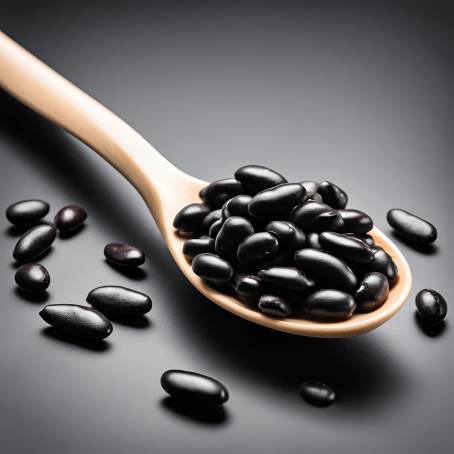 White Ceramic Spoon Filled with Black Beans Isolated on Black Background Detailed Food Photography