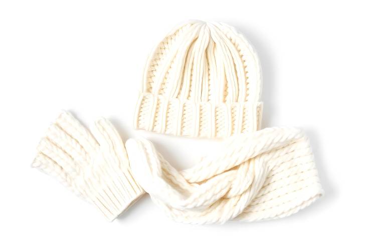 White Knitted Hat, Scarf, and Gloves Isolated on White Background Cozy Winter Accessories