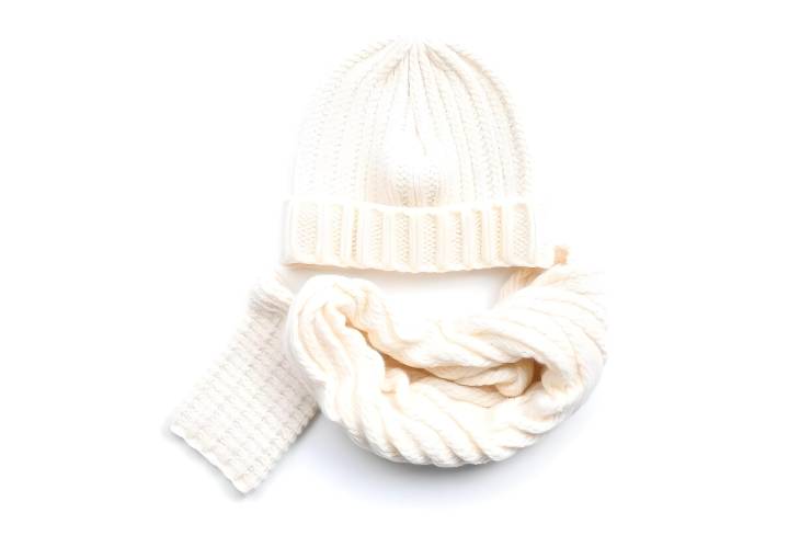 White Knitted Hat, Scarf, and Gloves Isolated Perfect Winter Accessories on White Background