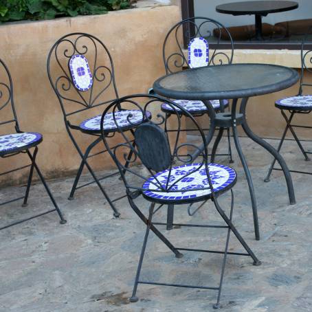 White Marble Floor with Wicker Chairs and Tables in Sophisticated Setting