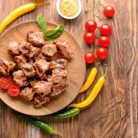 White Plate with Shish Kebab and Green Salad Juicy Grilled Meat with Fresh Vegetables