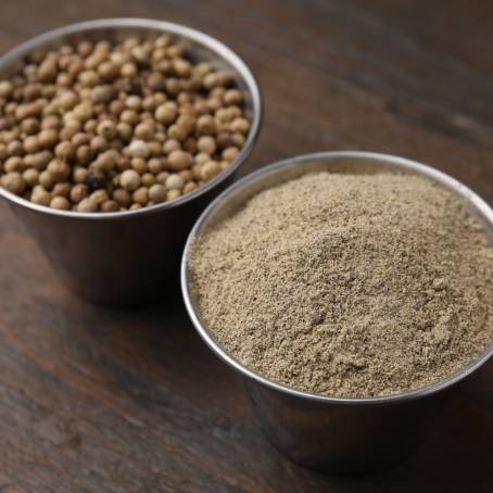 Wooden Bowl with Ground Pepper and Black Peppercorns